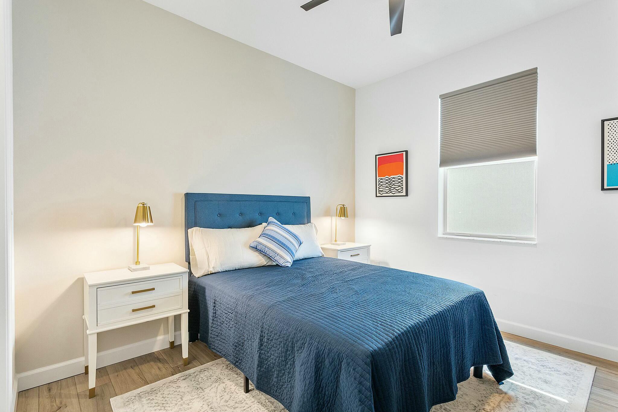 13404 Brotherhood Way Delray Beach, FL 33484 - Photo 20 of 44 a bedroom with a bed and a cabinets