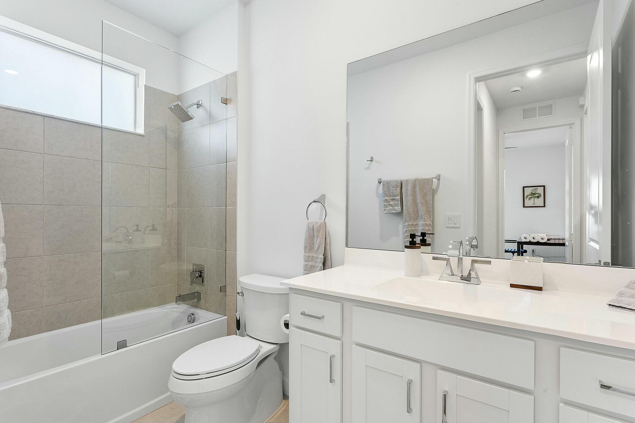 13404 Brotherhood Way Delray Beach, FL 33484 - Photo 22 of 44 a bathroom with a sink a toilet and shower