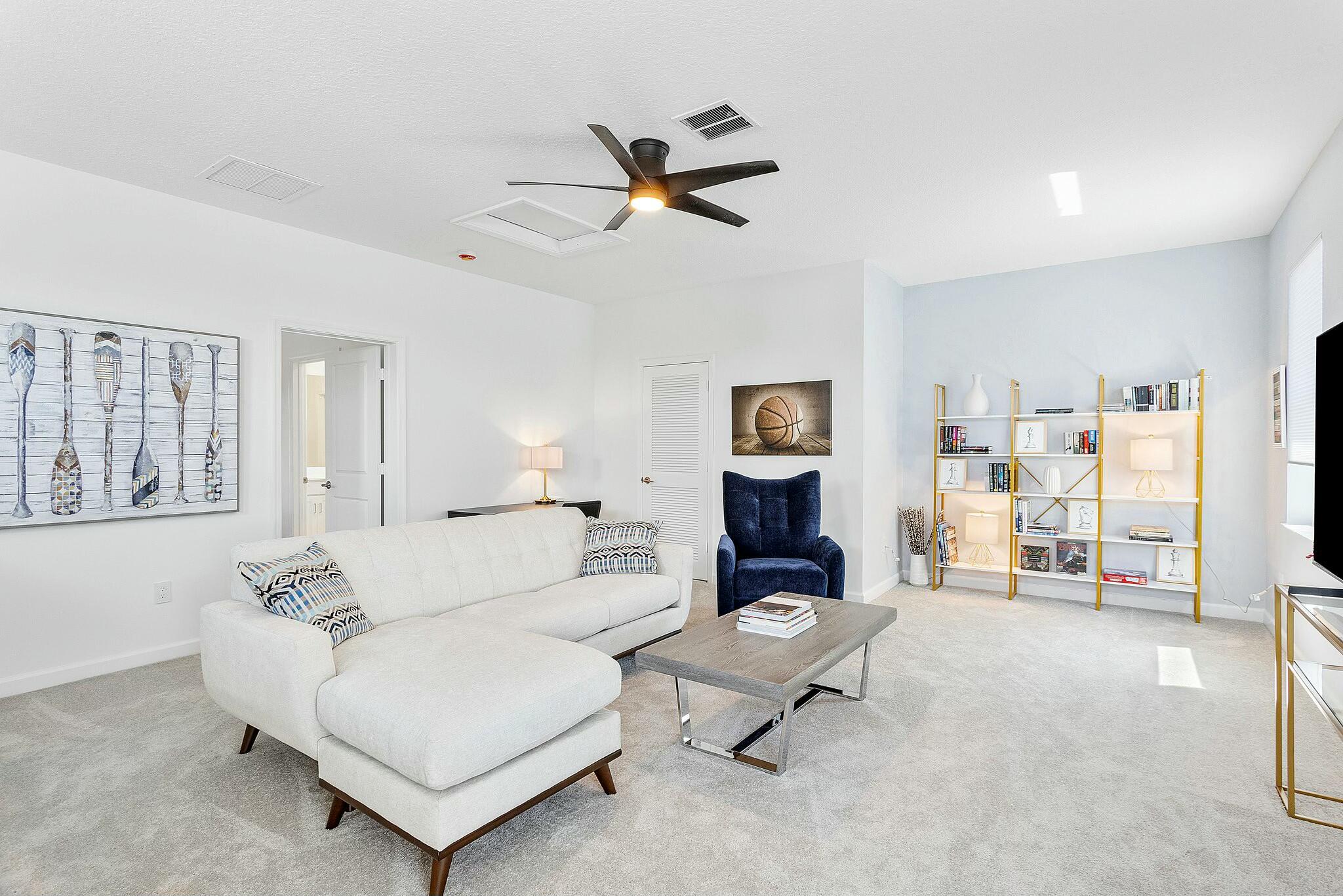 13404 Brotherhood Way Delray Beach, FL 33484 - Photo 24 of 44 a living room with furniture and a table