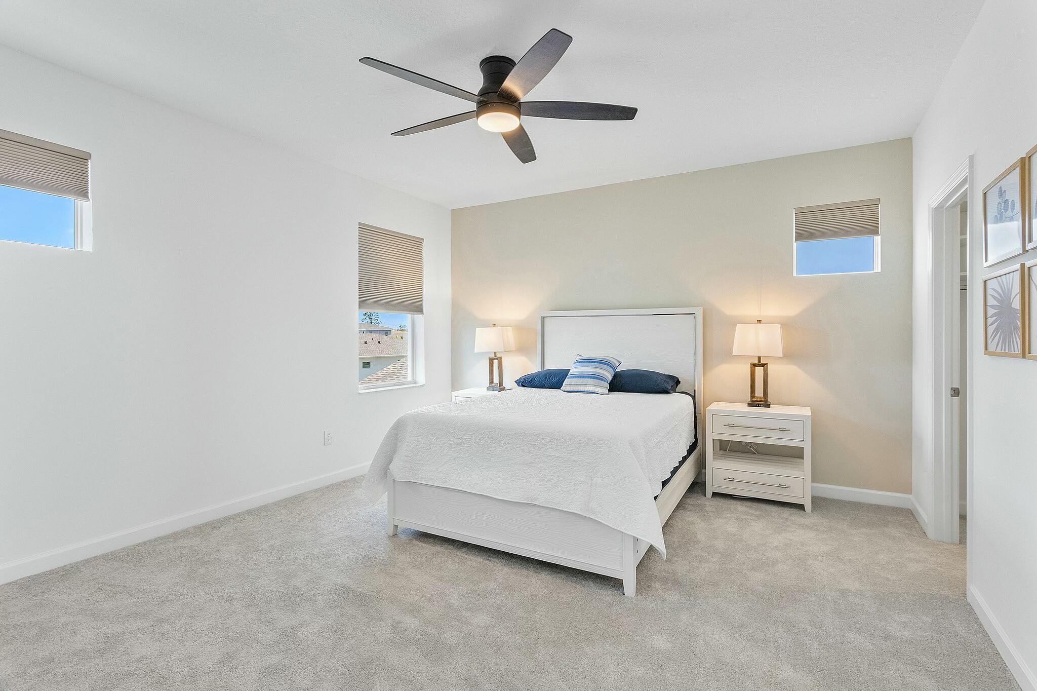 13404 Brotherhood Way Delray Beach, FL 33484 - Photo 27 of 44 a bedroom with a bed and a ceiling fan