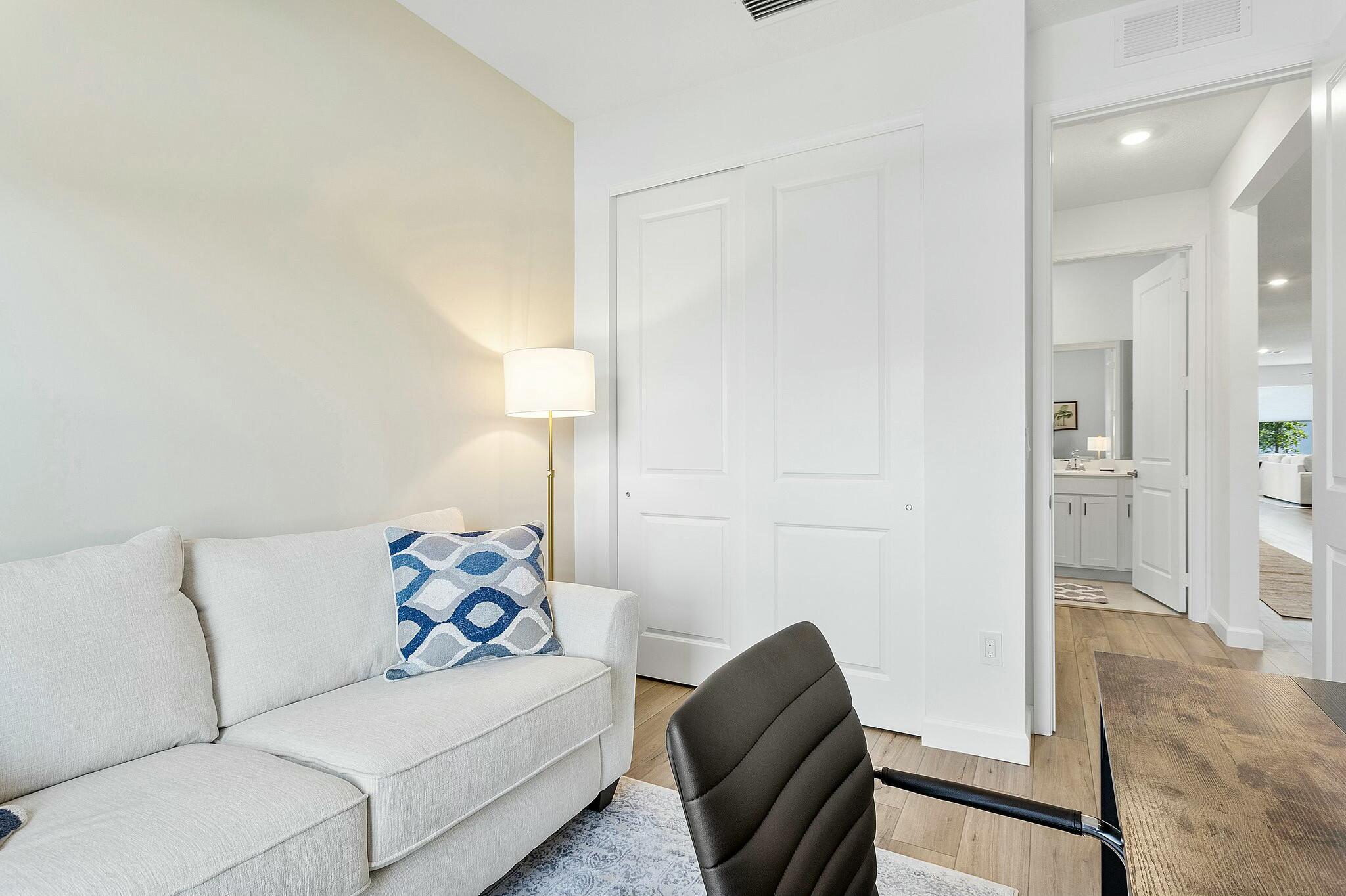 13404 Brotherhood Way Delray Beach, FL 33484 - Photo 31 of 44 a living room with furniture and a walk in closet