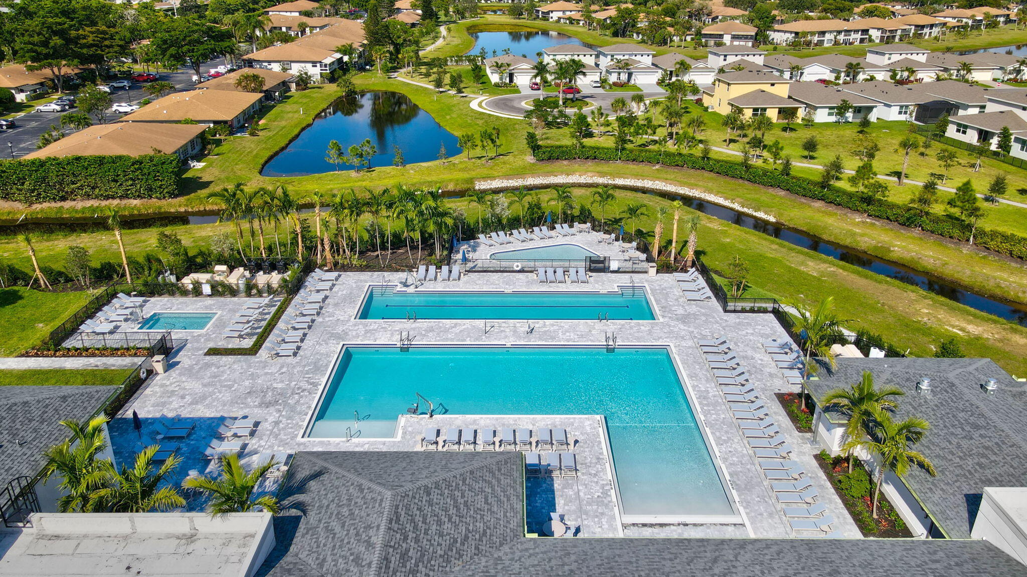 13404 Brotherhood Way Delray Beach, FL 33484 - Photo 35 of 44 an aerial view of a house with a garden and lake view