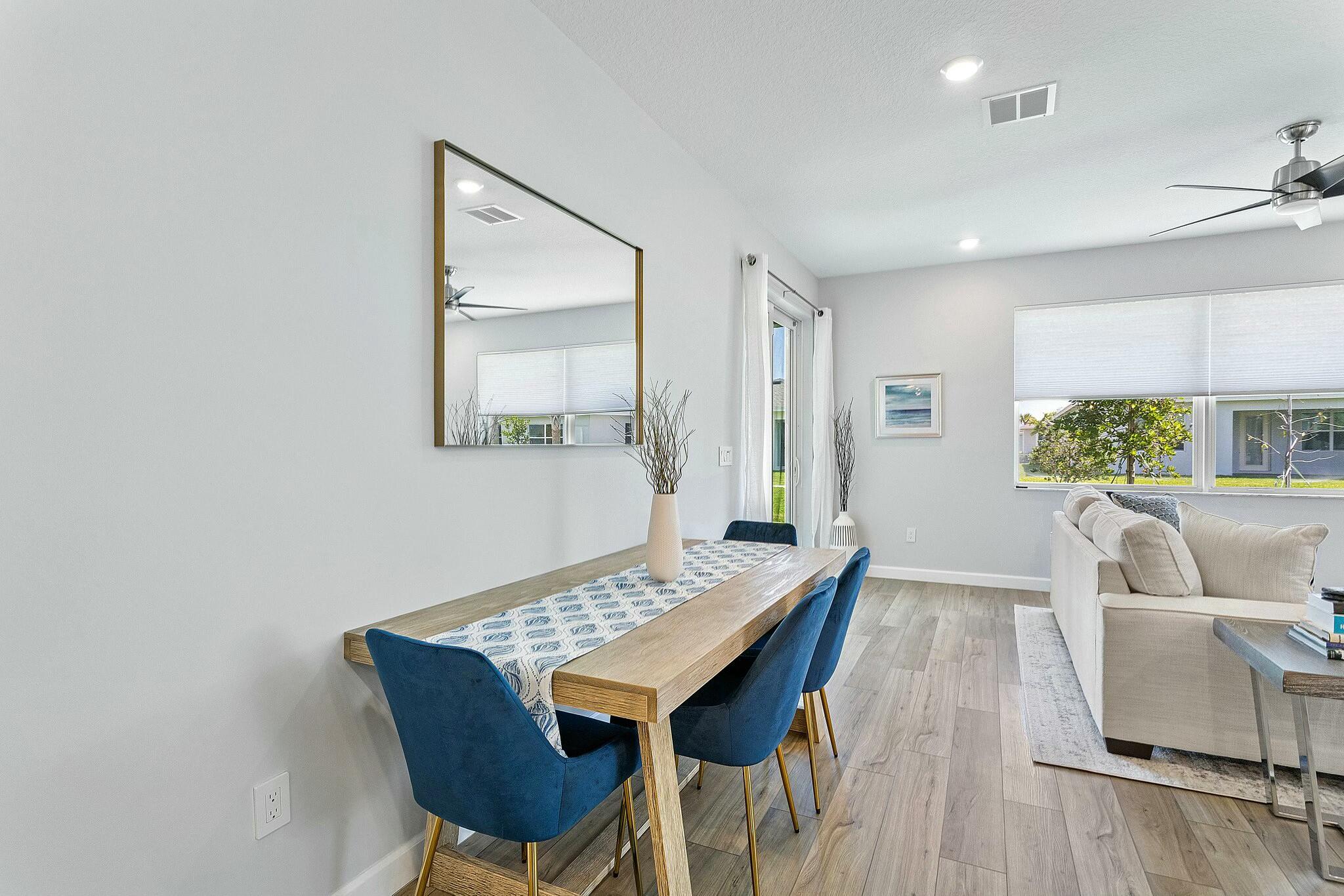 13404 Brotherhood Way Delray Beach, FL 33484 - Photo 8 of 44 a view of a dining room with furniture and wooden floor