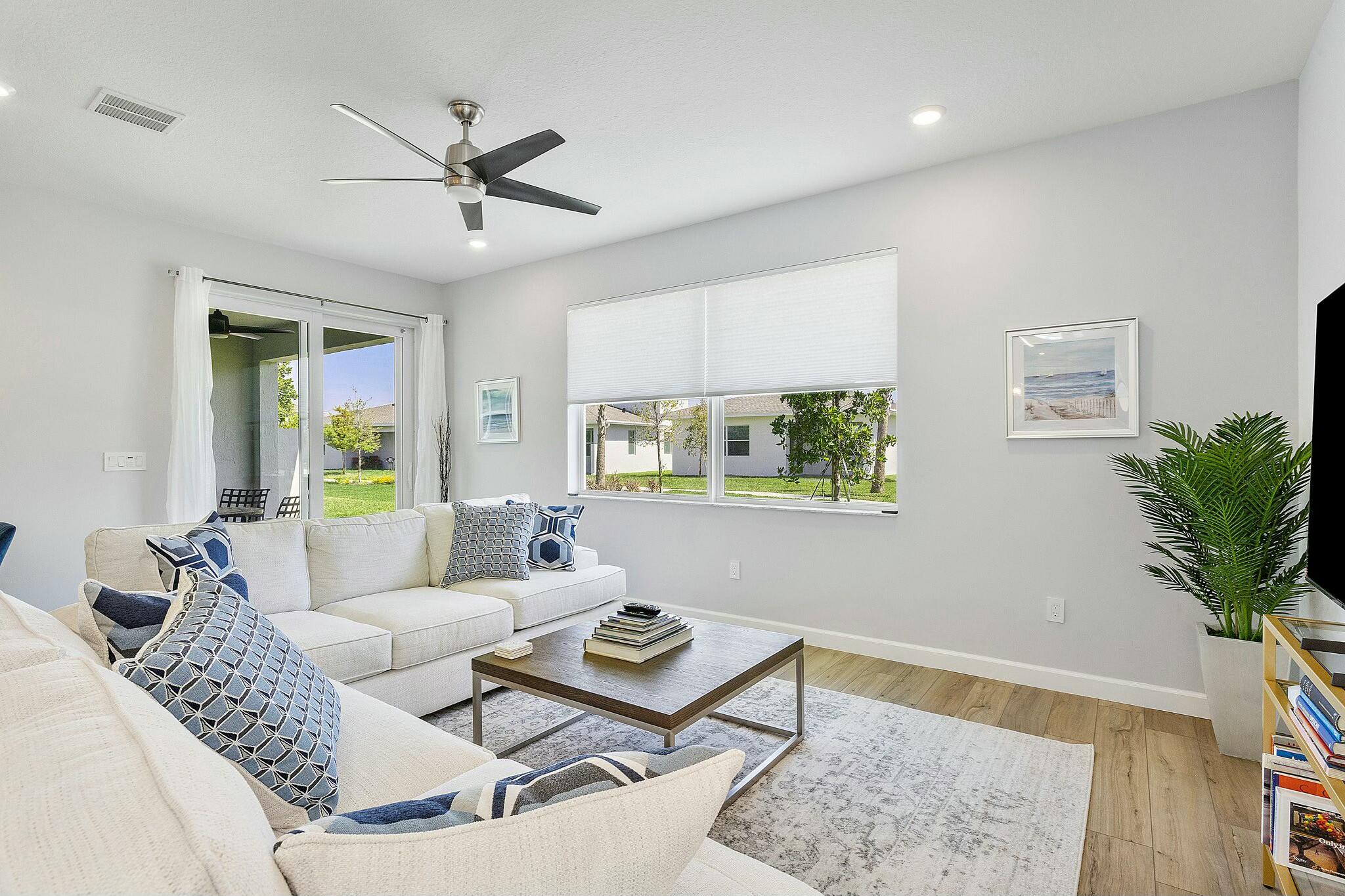 13404 Brotherhood Way Delray Beach, FL 33484 - Photo 10 of 44 a living room with furniture and a potted plant
