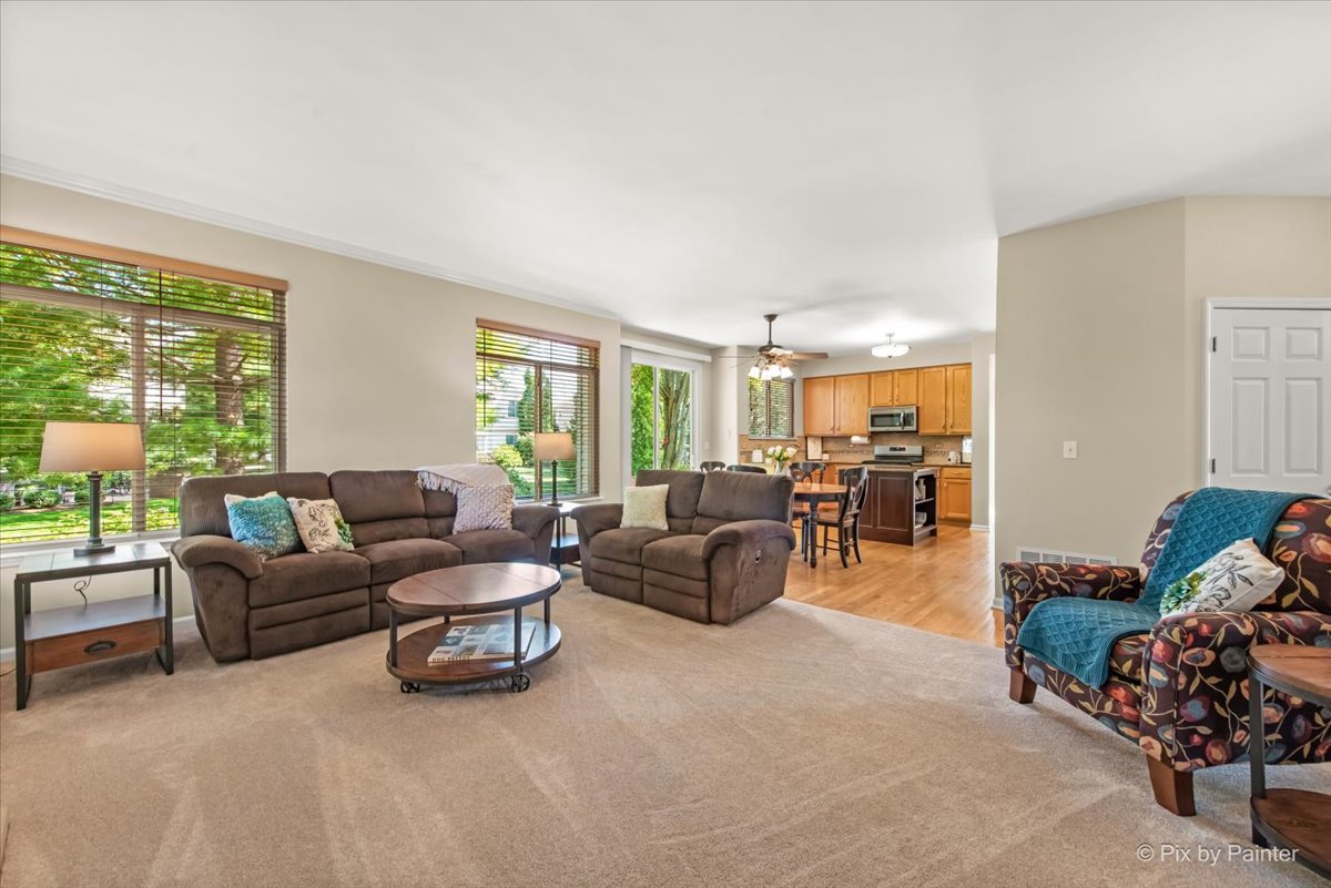 210 Ellis Road Lake In The Hills, IL 60156 - Photo 13 of 57 a living room with furniture and a large window