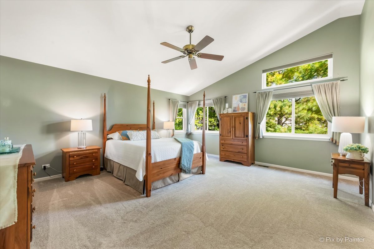 210 Ellis Road Lake In The Hills, IL 60156 - Photo 22 of 57 a bedroom with a large bed and a window