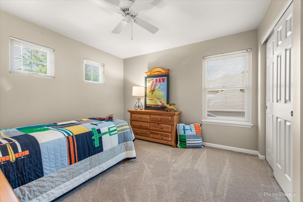 210 Ellis Road Lake In The Hills, IL 60156 - Photo 28 of 57 a bedroom with a bed and a window
