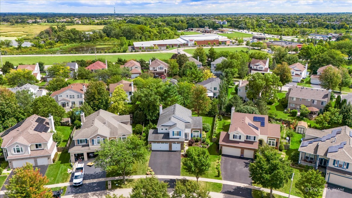 210 Ellis Road Lake In The Hills, IL 60156 - Photo 3 of 57 an aerial view of a houses with a yard