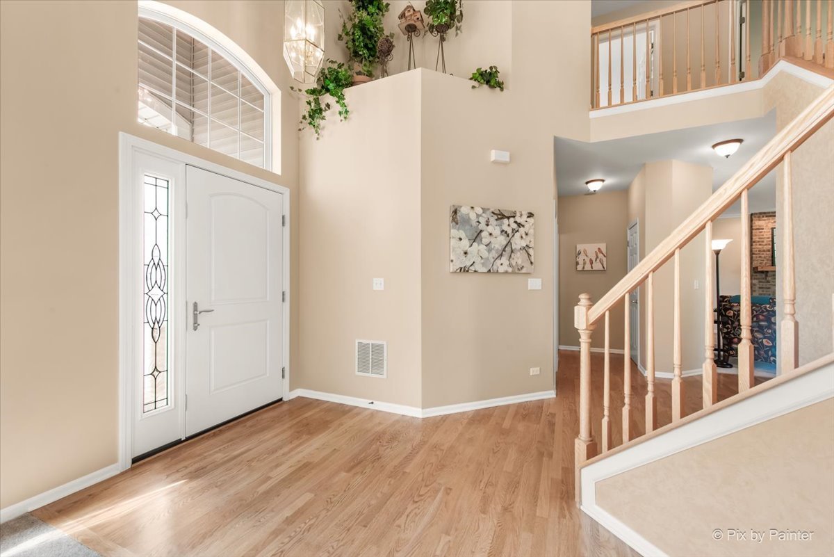 210 Ellis Road Lake In The Hills, IL 60156 - Photo 5 of 57 a view of an entryway with wooden floor