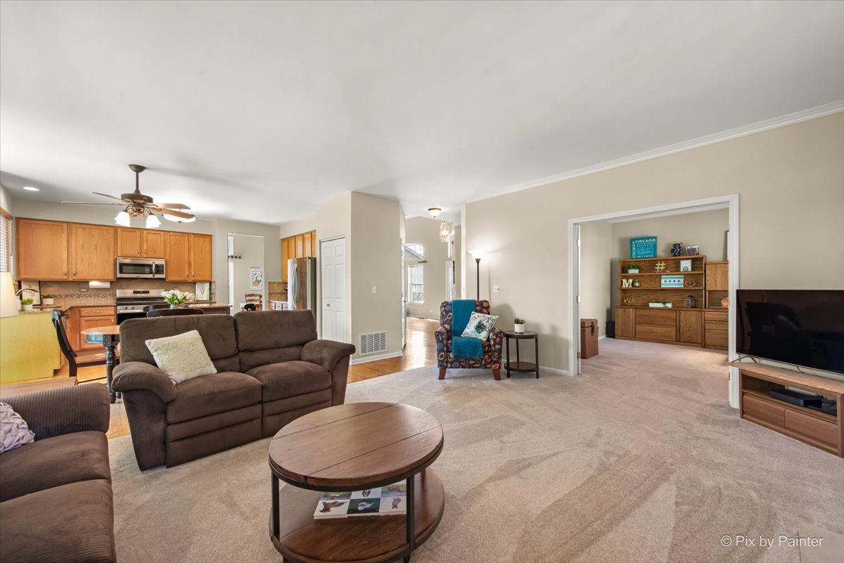210 Ellis Road Lake In The Hills, IL 60156 - Photo 9 of 57 a living room with furniture and a flat screen tv