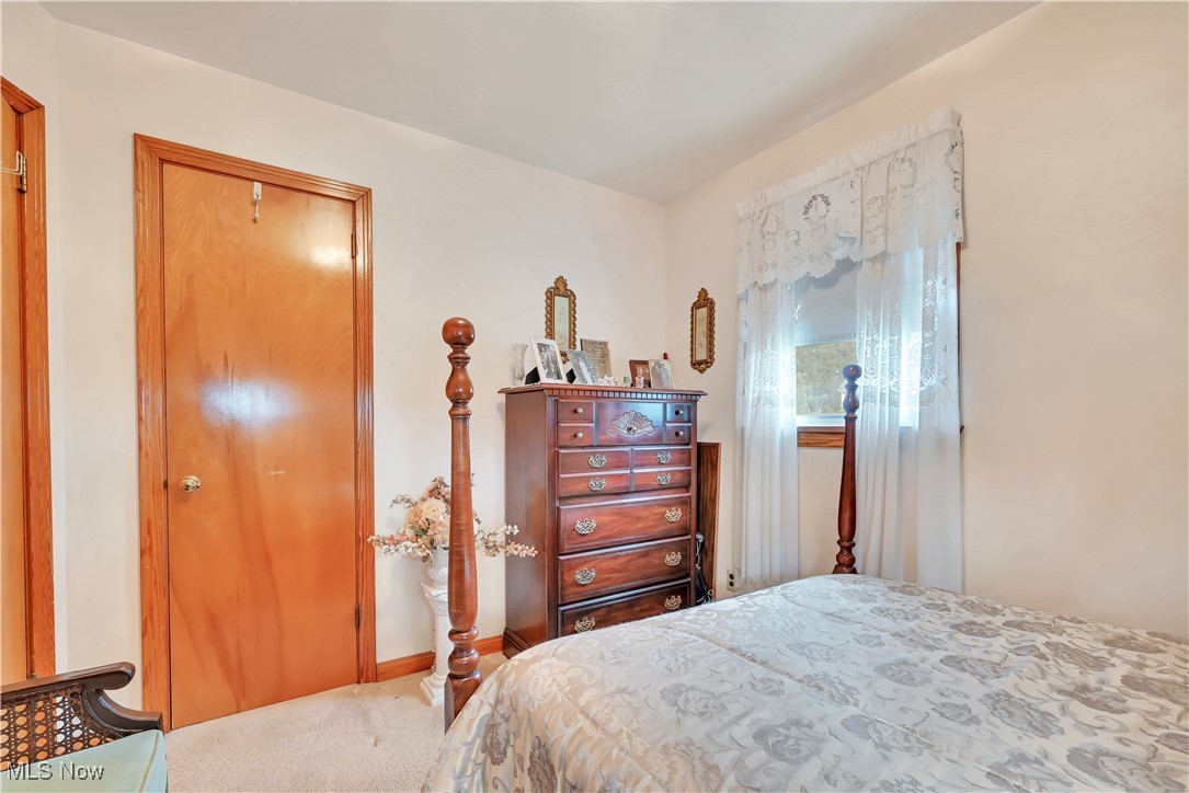 376 Johnson Plank Road Warren, OH 44481 - Photo 13 of 28 Bedroom with a closet and carpet flooring