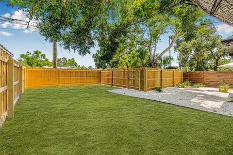 a backyard of a house with lots of green space