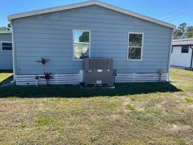 2883 Southwest Monarch Trail Stuart, FL 34997 - Photo 17 of 17 a view of a house with a yard
