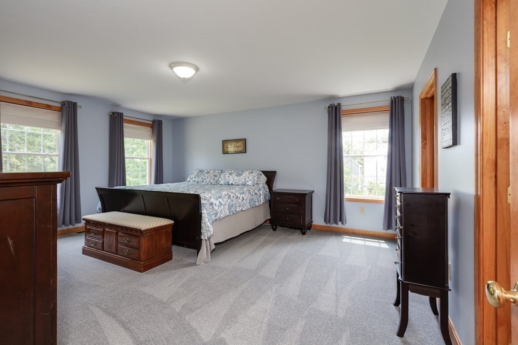 8 Ames Road Brookline, NH 03033 - Photo 12 of 26 a living room with a bed furniture and a window