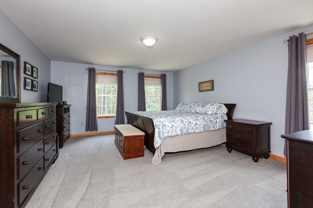 8 Ames Road Brookline, NH 03033 - Photo 13 of 26 a bedroom with a bed and a couch