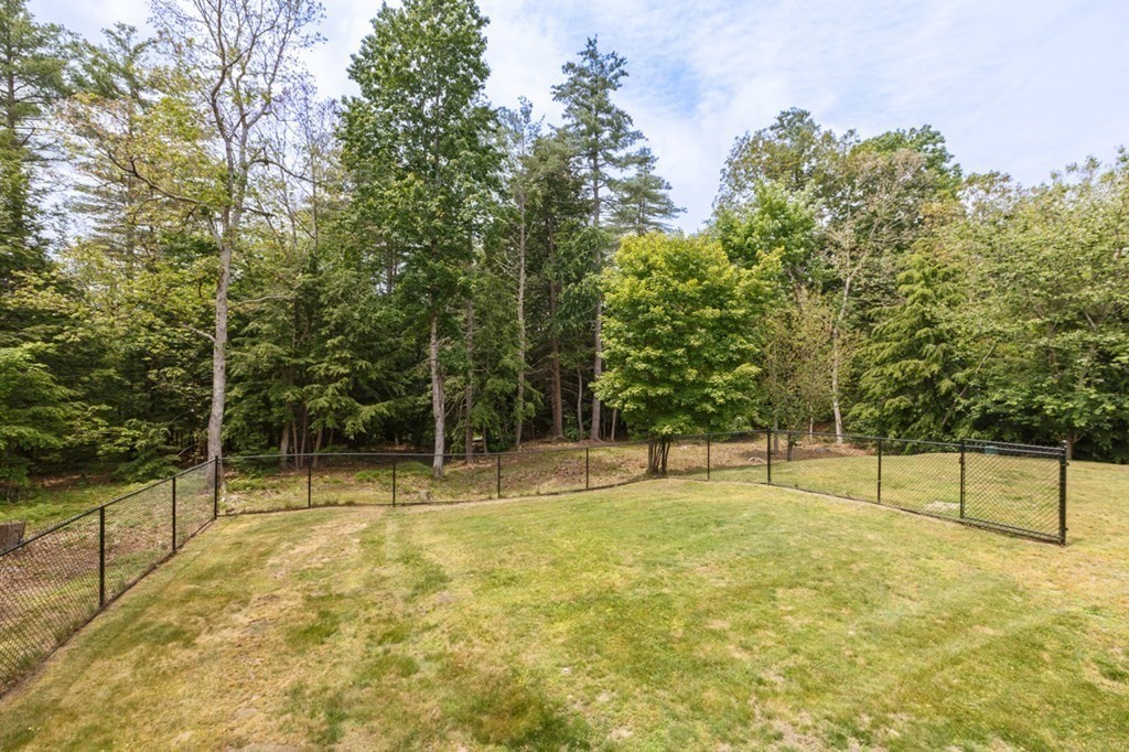 8 Ames Road Brookline, NH 03033 - Photo 23 of 26 a view of outdoor space with deck and trees