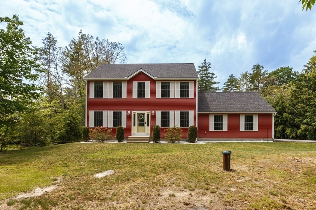 8 Ames Road Brookline, NH 03033 - Photo 26 of 26 a front view of a house with a garden and lake view