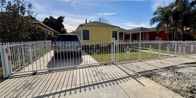 a view of a house with a wooden deck