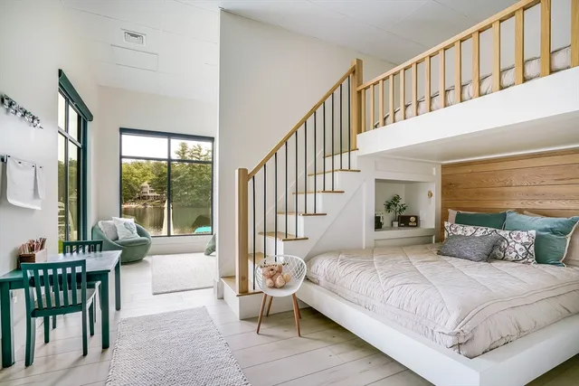 a bedroom with a bed and a table