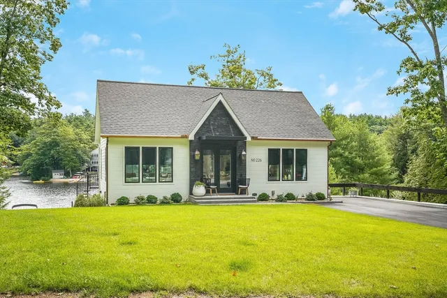 a front view of house with yard outdoor seating and barbeque oven