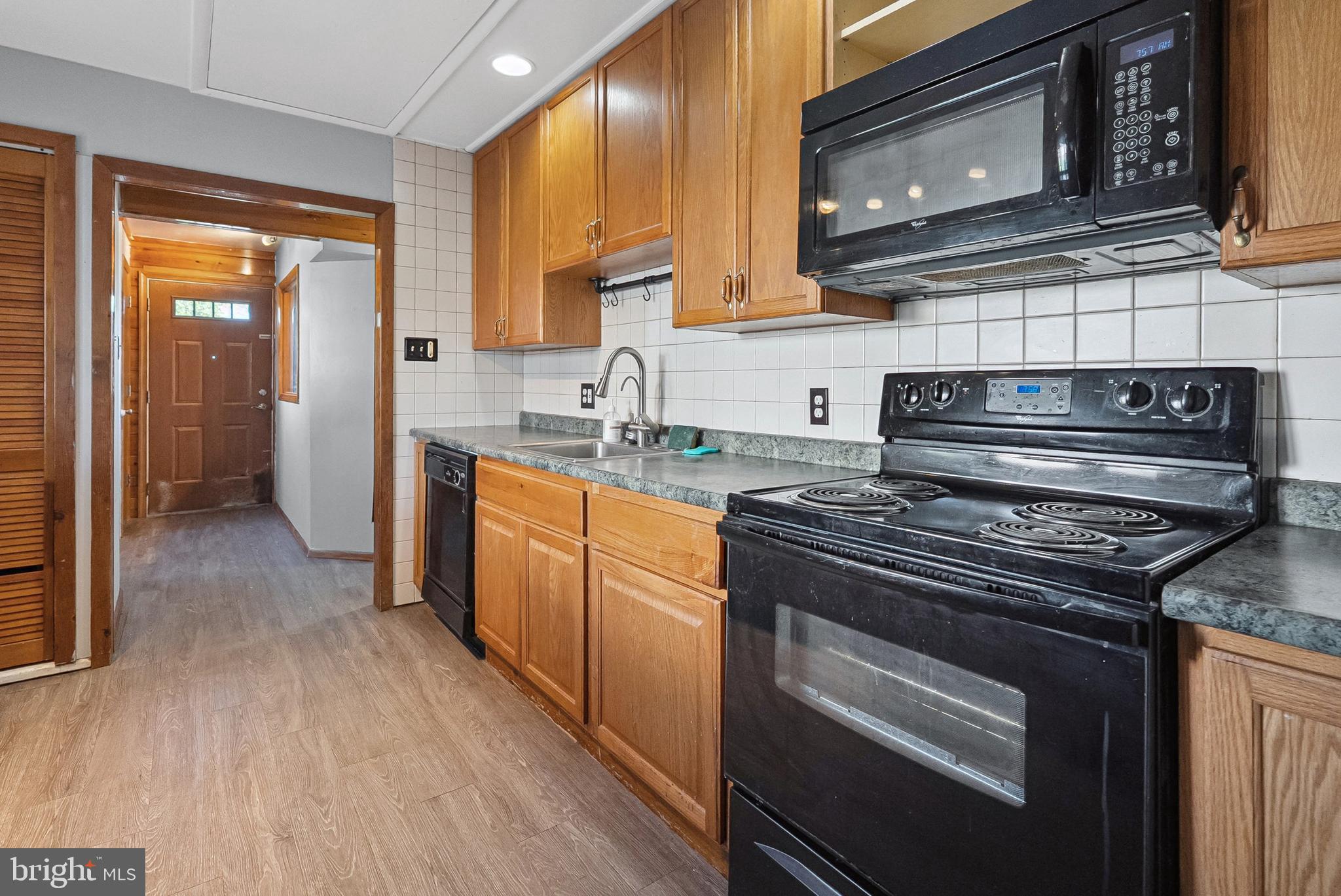 1866 Marshall Road Baltimore, MD 21222 - Photo 13 of 30 a kitchen with a stove and a microwave