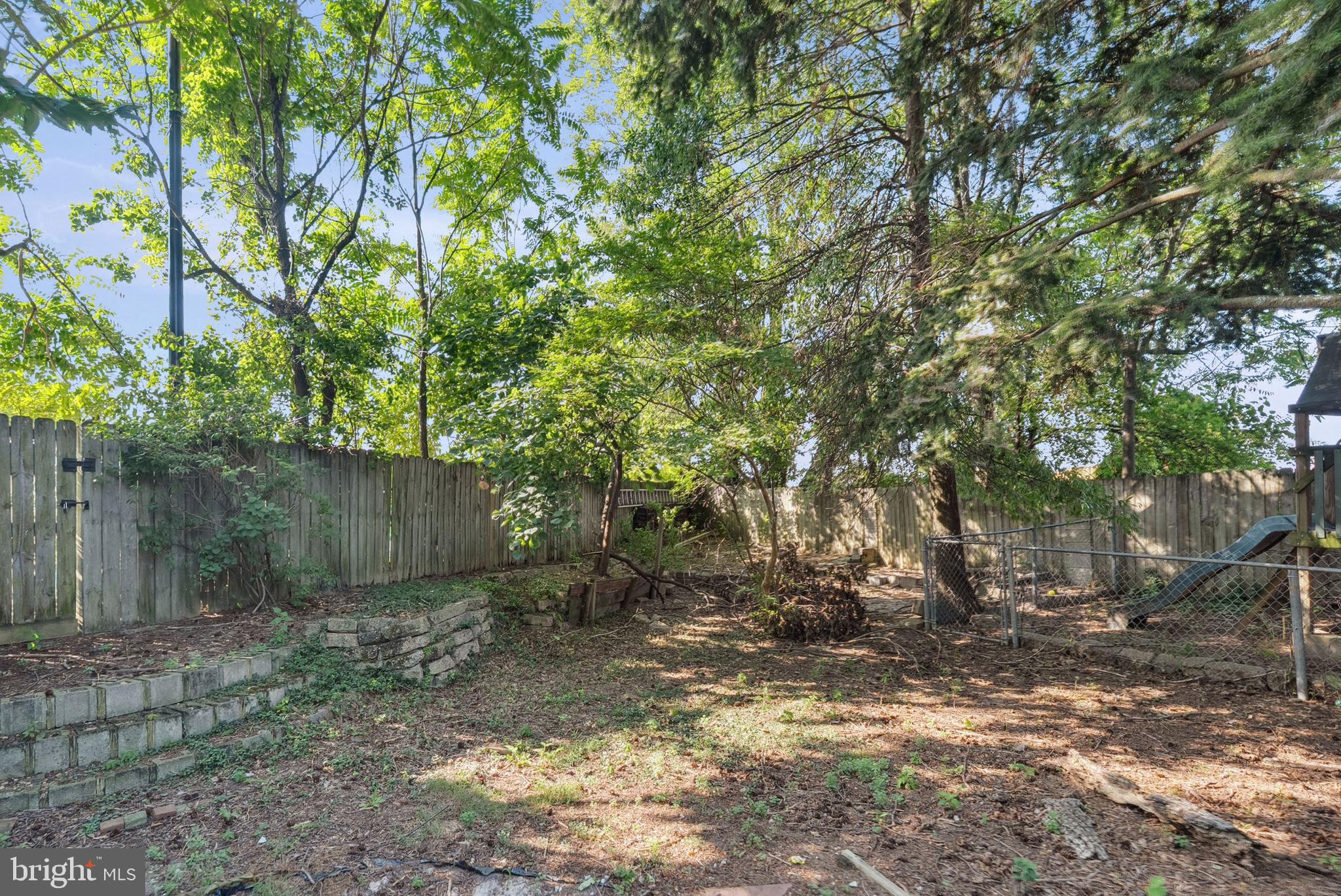 1866 Marshall Road Baltimore, MD 21222 - Photo 25 of 30 a backyard of a house with lots of plants and tree