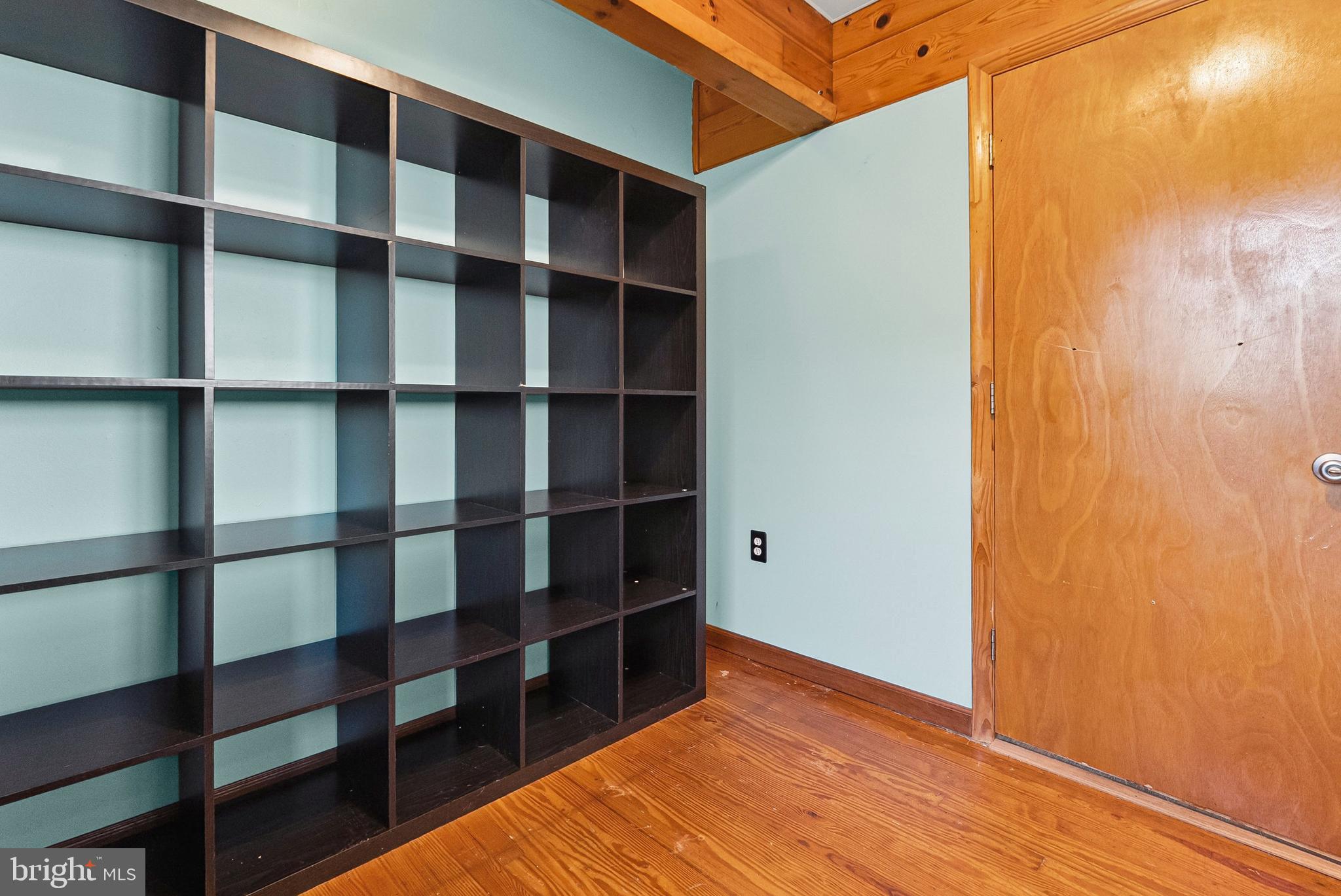 1866 Marshall Road Baltimore, MD 21222 - Photo 4 of 30 a view of empty room with wooden floor and shelf