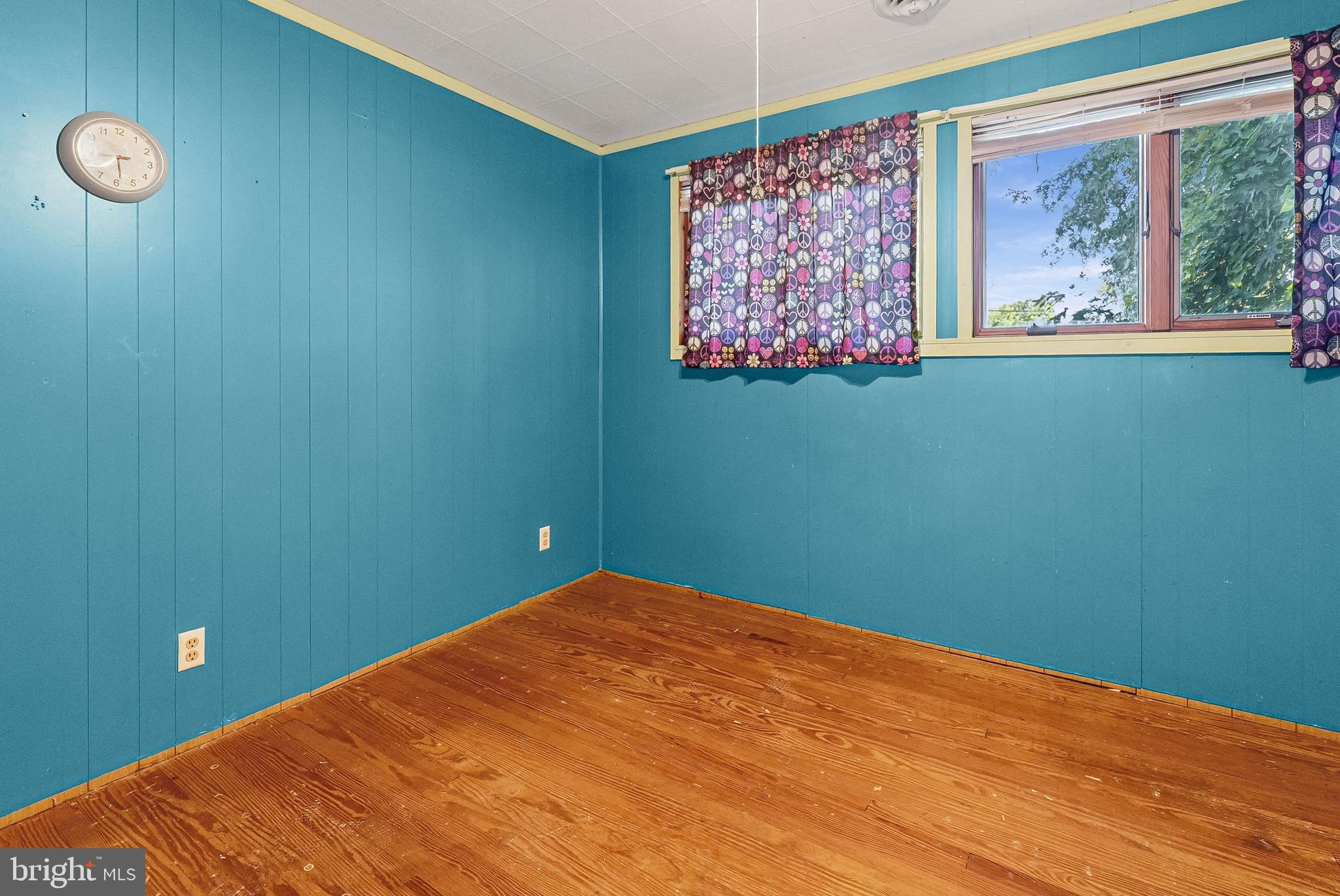 1866 Marshall Road Baltimore, MD 21222 - Photo 6 of 30 a view of a big room with wooden floor and windows