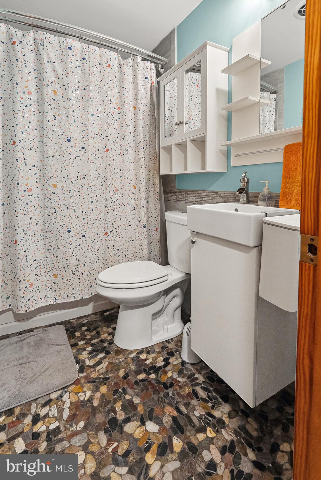 1866 Marshall Road Baltimore, MD 21222 - Photo 8 of 30 a bathroom with a sink toilet and shower