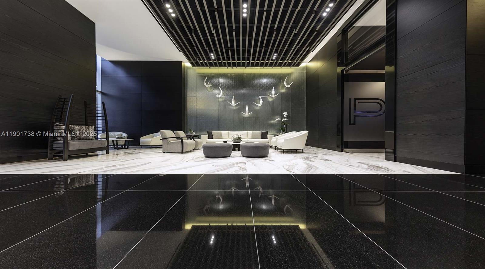 851 Northeast 1st Avenue, Unit 2106 Miami, FL 33132 - Photo 30 of 52 a kitchen with a sink and cabinets