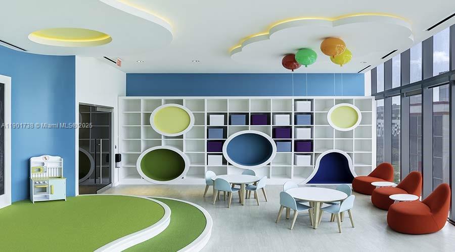 851 Northeast 1st Avenue, Unit 2106 Miami, FL 33132 - Photo 42 of 52 a living room with a table and chairs