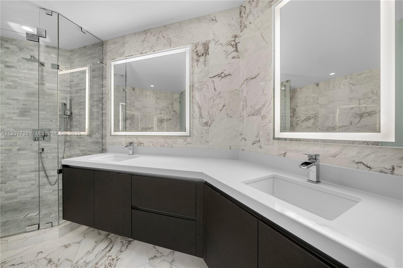 851 Northeast 1st Avenue, Unit 2106 Miami, FL 33132 - Photo 8 of 52 a bathroom with a sink and a mirror