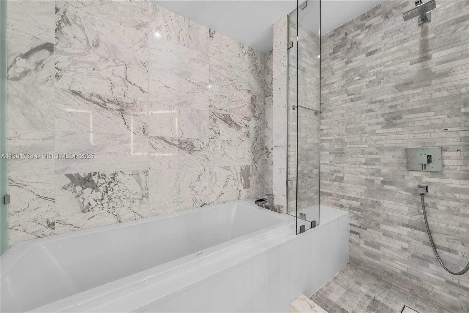 851 Northeast 1st Avenue, Unit 2106 Miami, FL 33132 - Photo 10 of 52 a bathroom with a bathtub