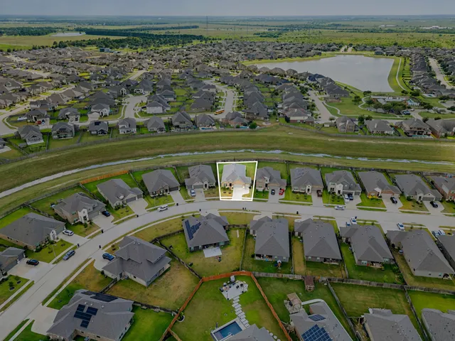 view of a lake with a table and chairs