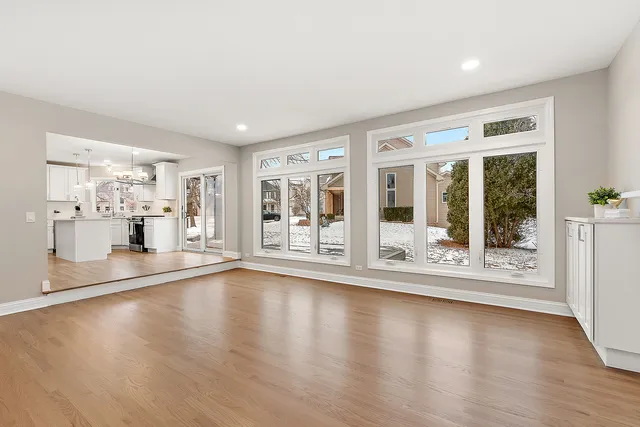 a bathroom with a granite countertop sink a toilet and a mirror
