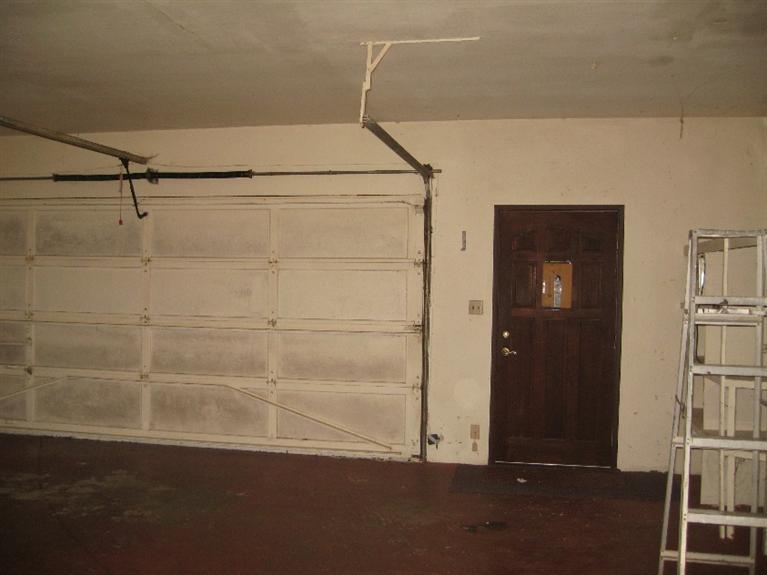 4988 Holland Loop Road Cave Junction, OR 97523 - Photo 6 of 35 a room with a wooden floor and potted plant on the wall