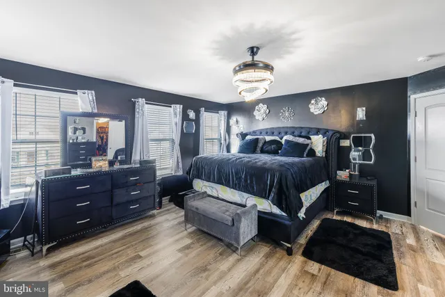 a bedroom with a large bed and a tv