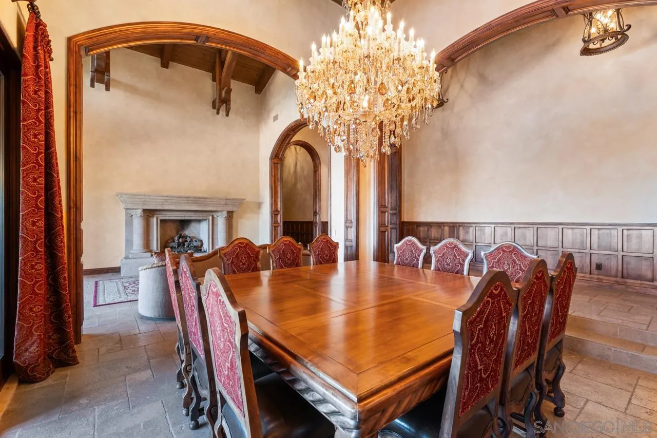 19612 Rangeland Road Ramona, CA 92065 - Photo 21 of 65 a dining room with furniture a chandelier and wooden floor