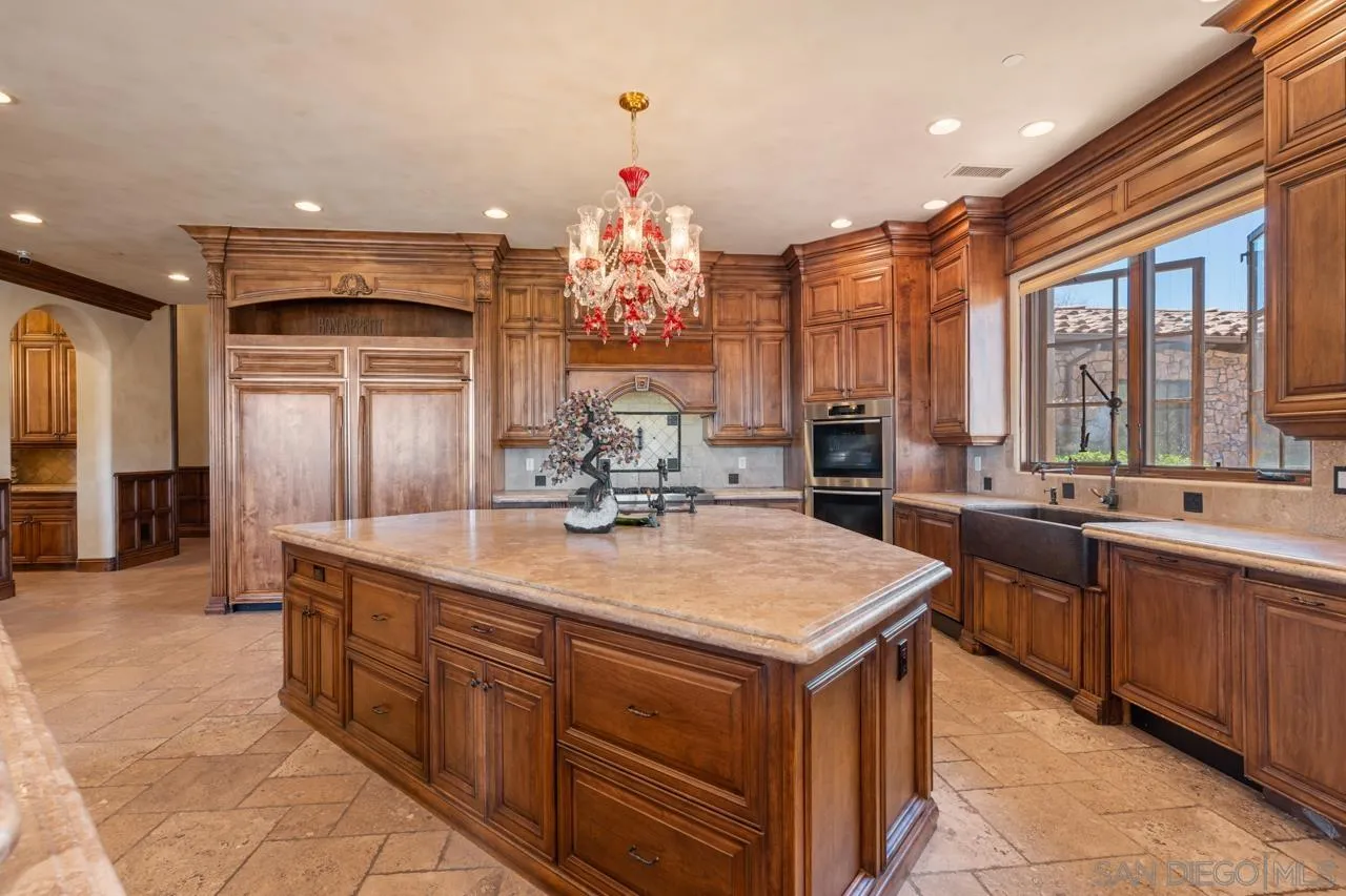 19612 Rangeland Road Ramona, CA 92065 - Photo 28 of 65 a kitchen with a sink stove and cabinets