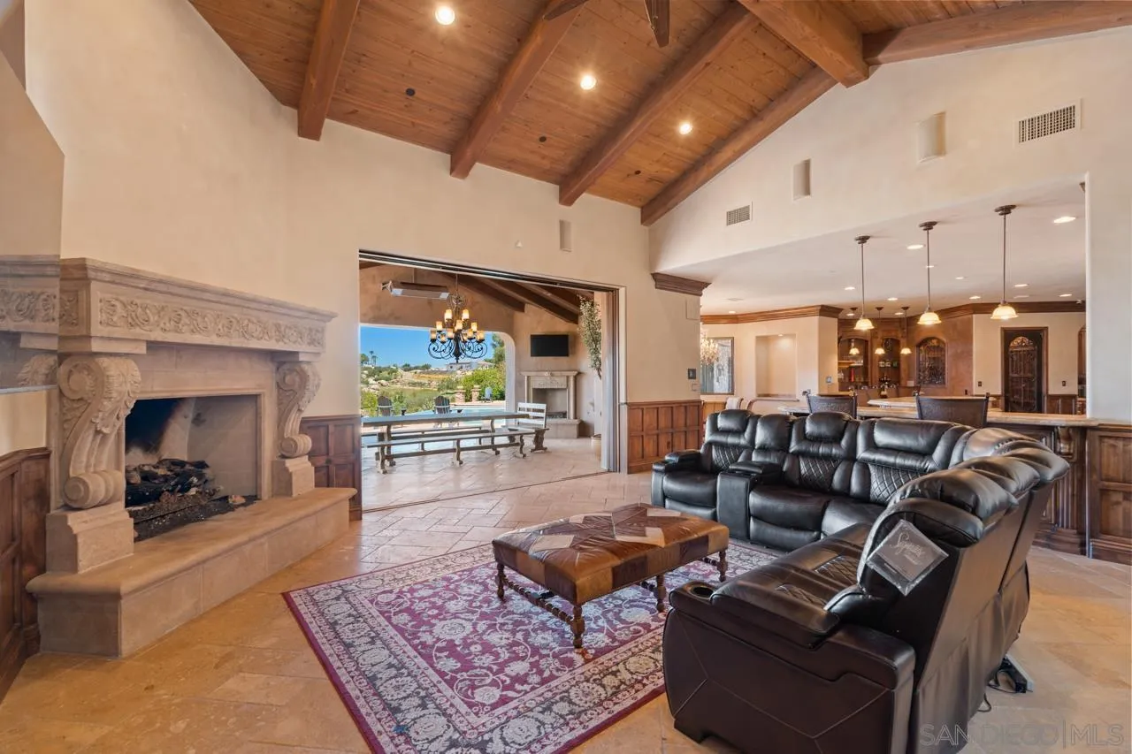 19612 Rangeland Road Ramona, CA 92065 - Photo 32 of 65 a living room with furniture and a fireplace