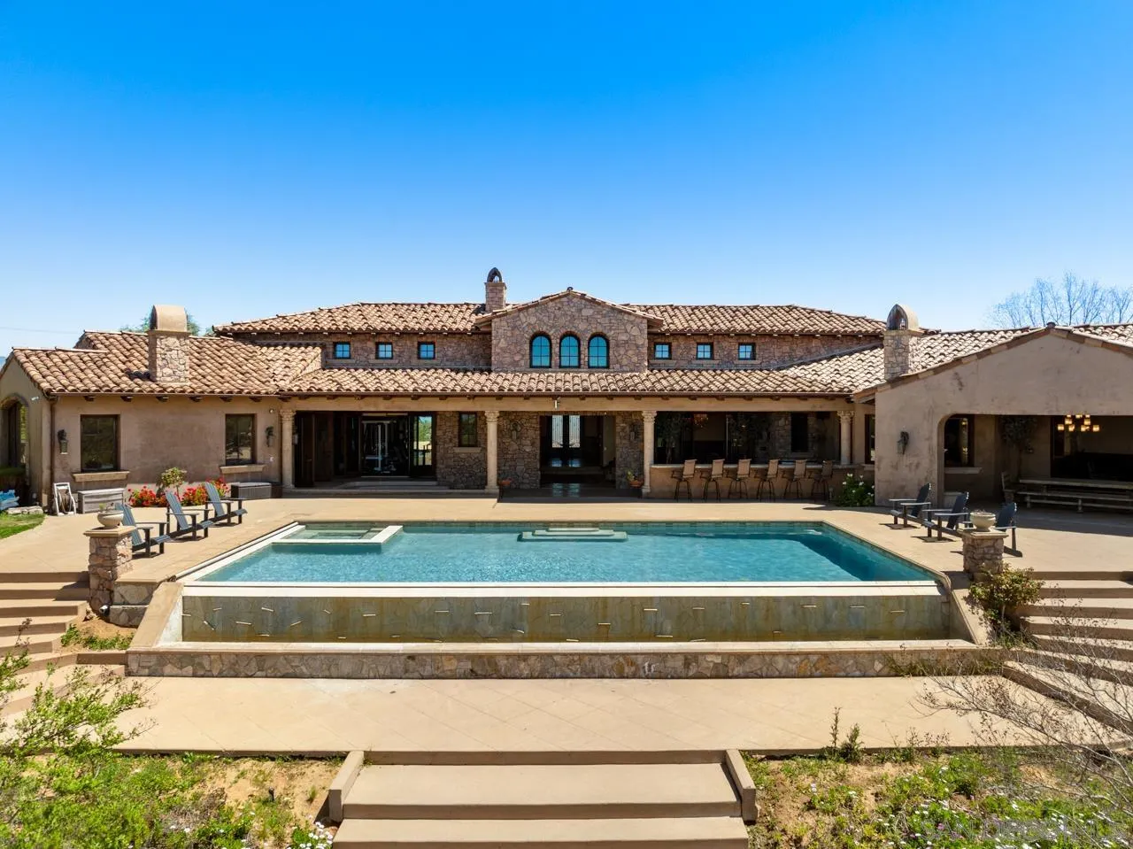 19612 Rangeland Road Ramona, CA 92065 - Photo 38 of 65 a view of a big house with swimming pool in front of it