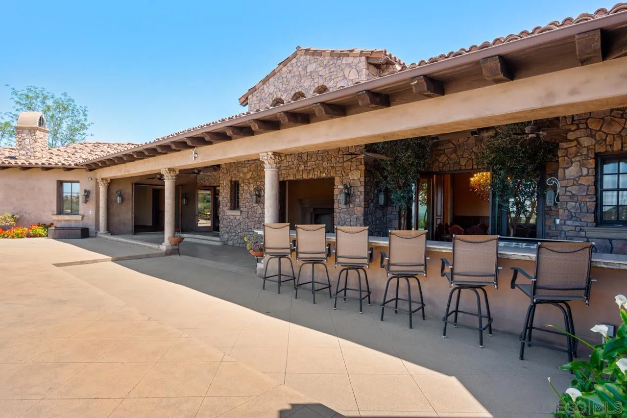 19612 Rangeland Road Ramona, CA 92065 - Photo 40 of 65 a view of a patio with dining table and chairs