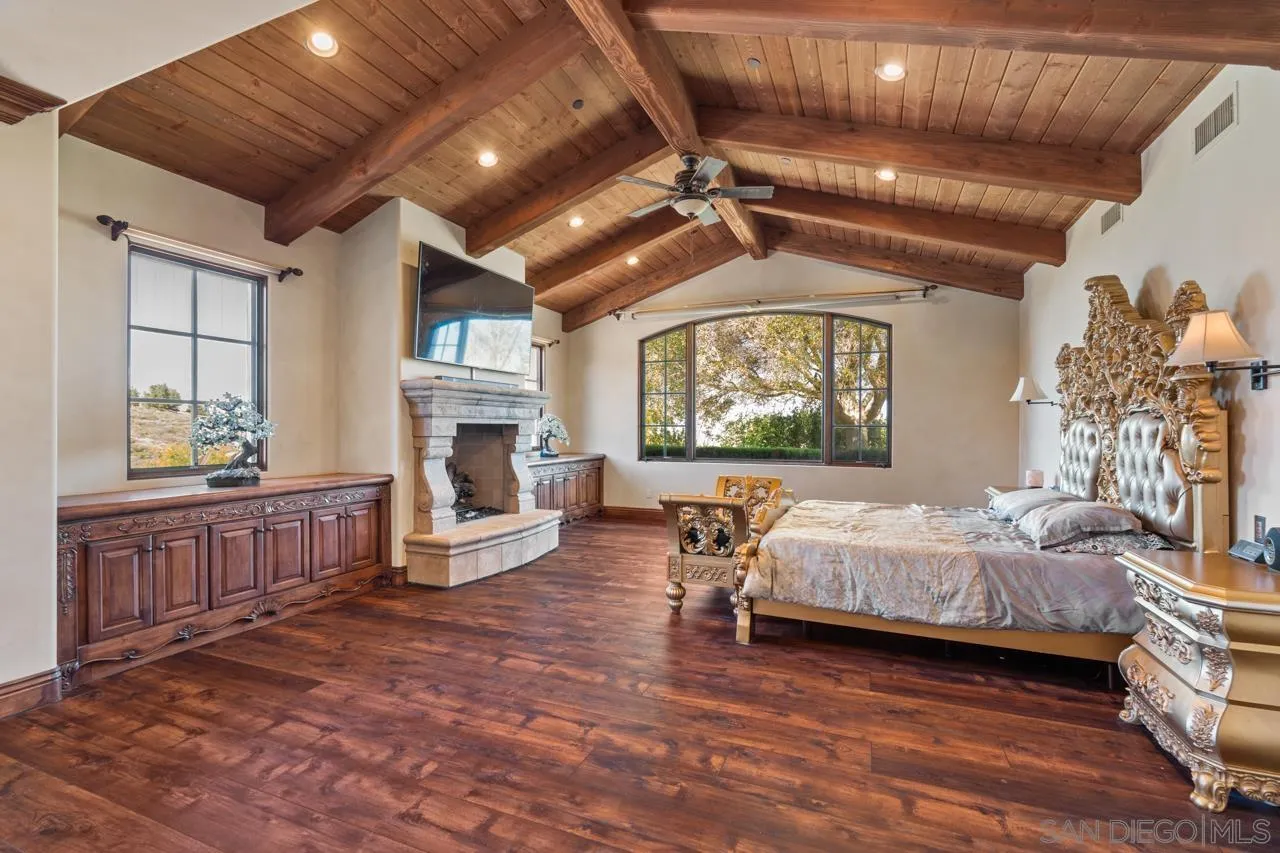 19612 Rangeland Road Ramona, CA 92065 - Photo 43 of 65 a living room with furniture a fireplace and a chandelier