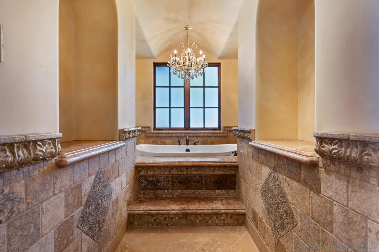 19612 Rangeland Road Ramona, CA 92065 - Photo 48 of 65 a spacious bathroom with a bathtub and shower