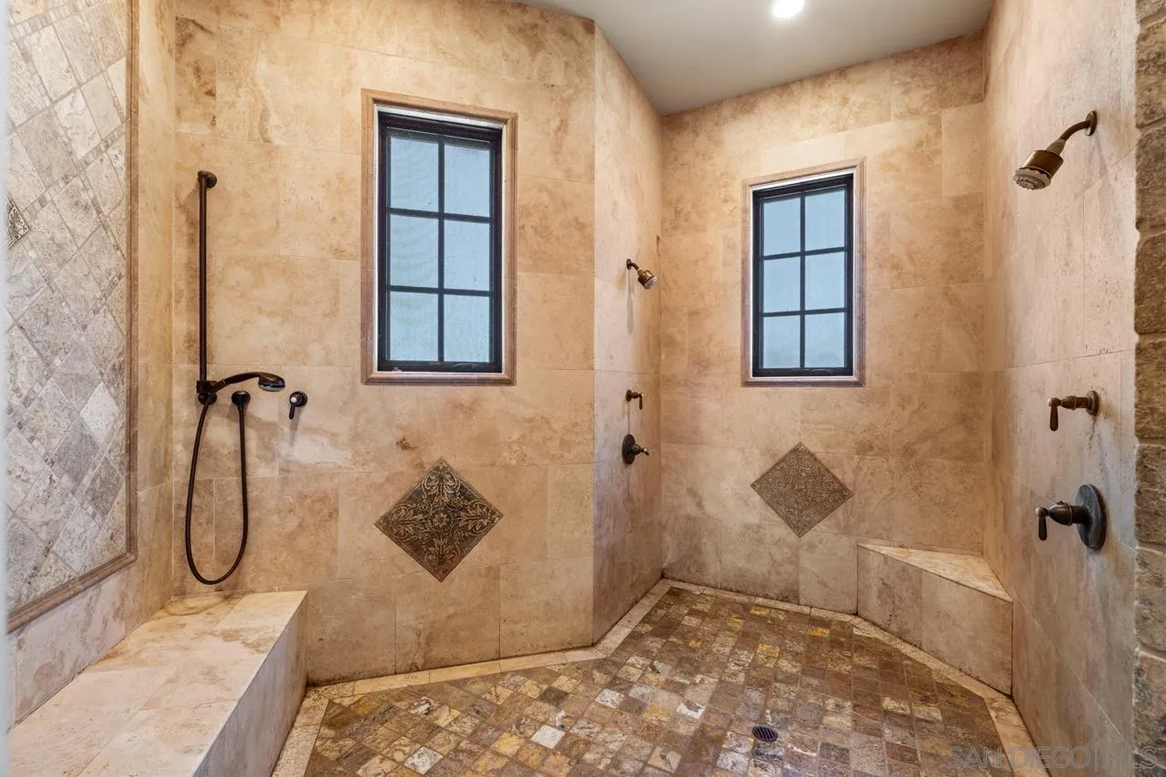 19612 Rangeland Road Ramona, CA 92065 - Photo 49 of 65 a bathroom with a granite countertop shower and a sink