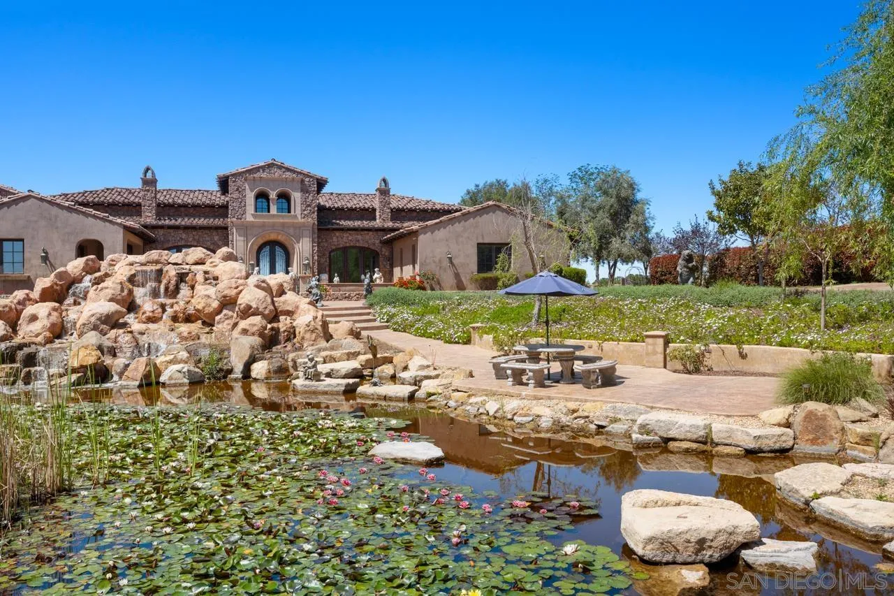 19612 Rangeland Road Ramona, CA 92065 - Photo 5 of 65 a view of a house with a yard and sitting area