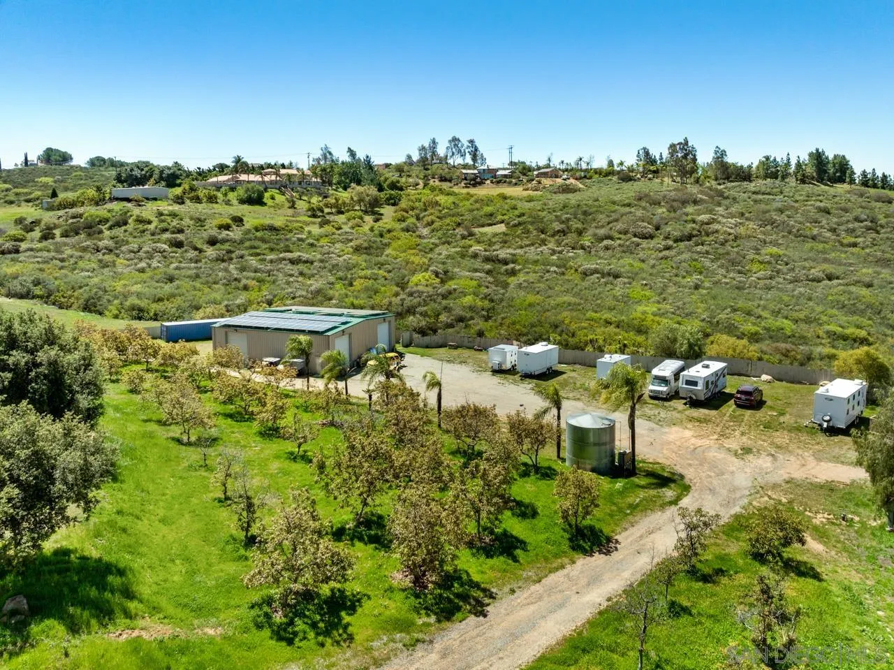 19612 Rangeland Road Ramona, CA 92065 - Photo 63 of 65 a view of a lake with a building in the background