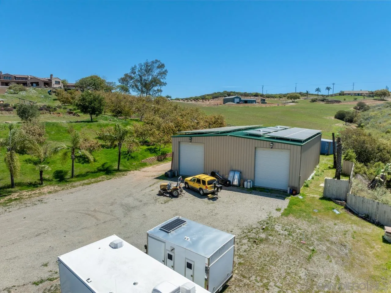 19612 Rangeland Road Ramona, CA 92065 - Photo 64 of 65 an aerial view of a house with a garden and lake view