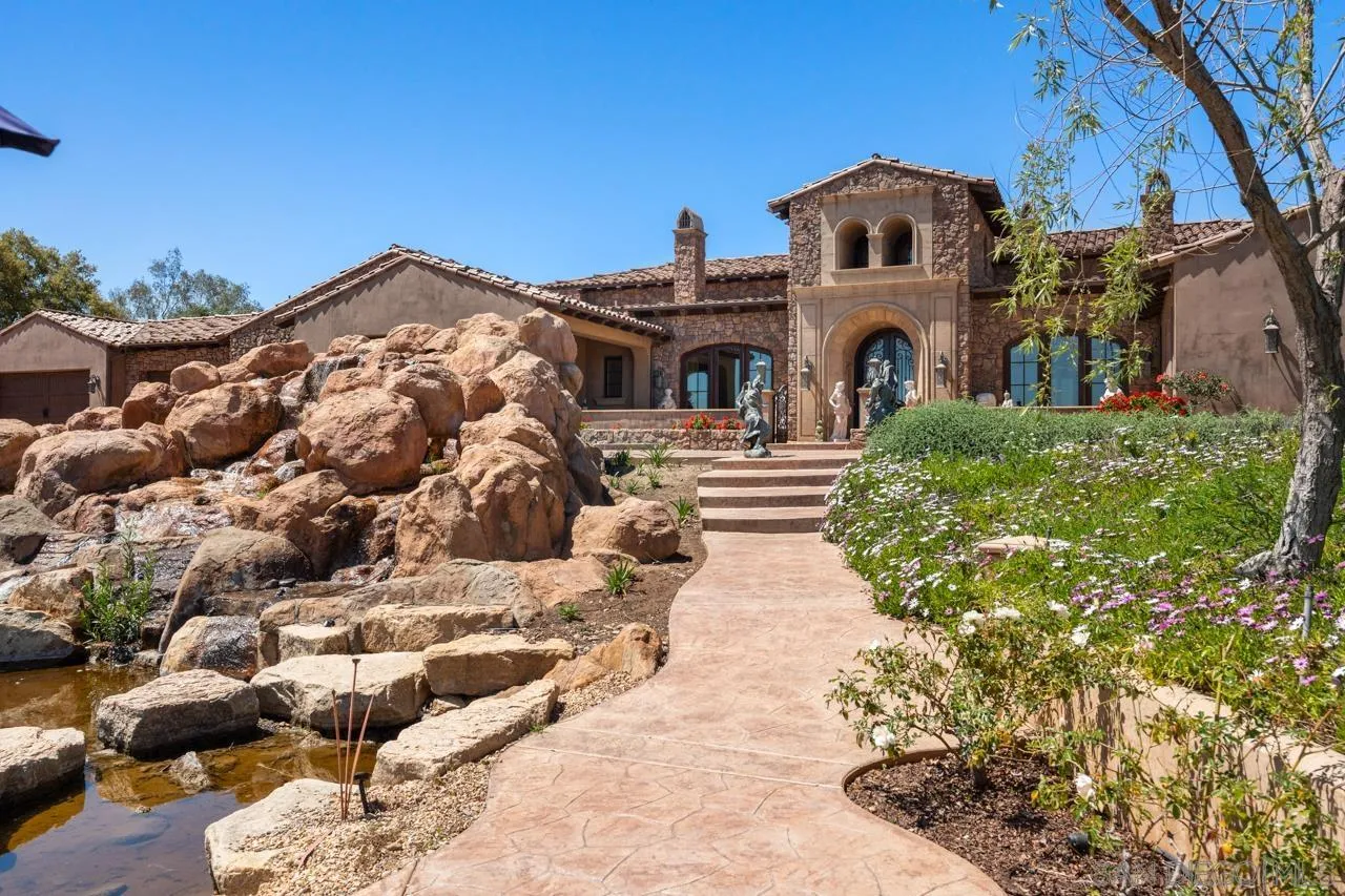 19612 Rangeland Road Ramona, CA 92065 - Photo 8 of 65 a front view of a house with a yard