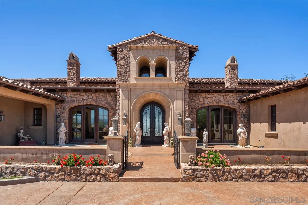 19612 Rangeland Road Ramona, CA 92065 - Photo 9 of 65 a view of a building with a garden